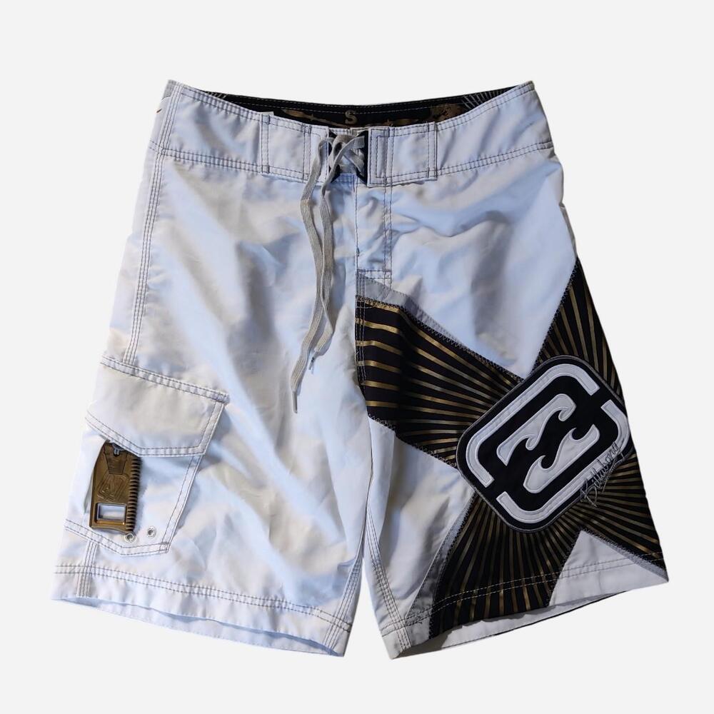 Y2K Billabong Shane Dorian board shorts with black and gold starburst graphic wi